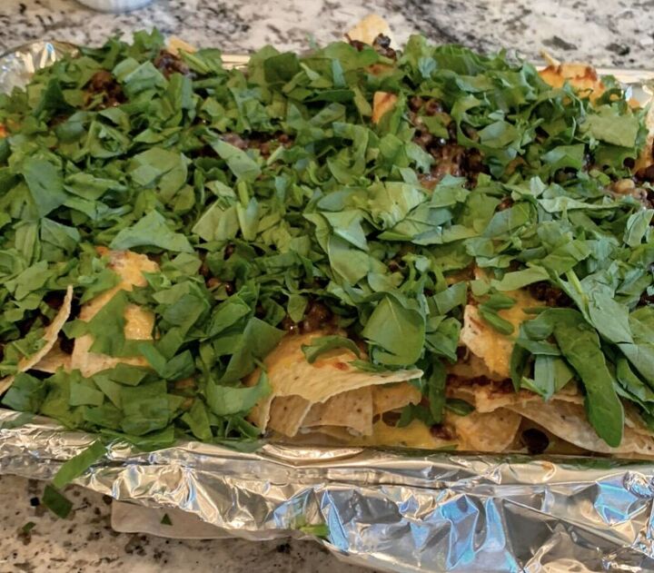 loaded garden nachos with cilantro and spinach