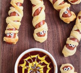 mummy hot dogs with spider web sauce