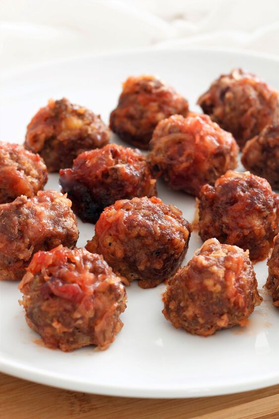 s 15 slow cooker recipes we re definitely trying this season, Cranberry Sauerkraut Meatballs