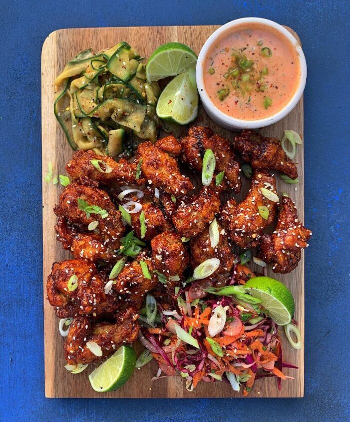 spicy korean wings with a buttermilk dressing and cucumber salad