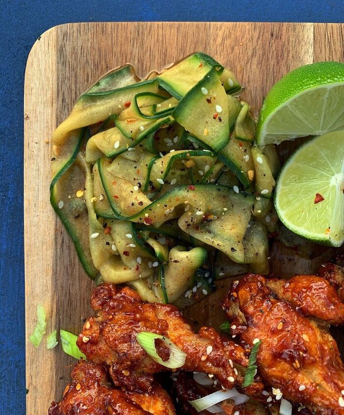 spicy korean wings with a buttermilk dressing and cucumber salad
