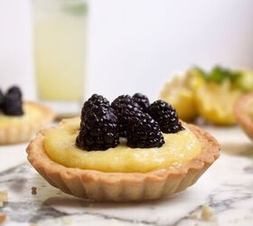 s 18 mini desserts that ll convince you to skip the pie this year, Mini Lemon Blackberry Tarts