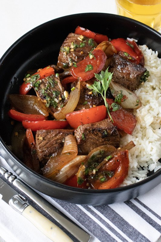 marinated sirloin steak tips with peppers and onions