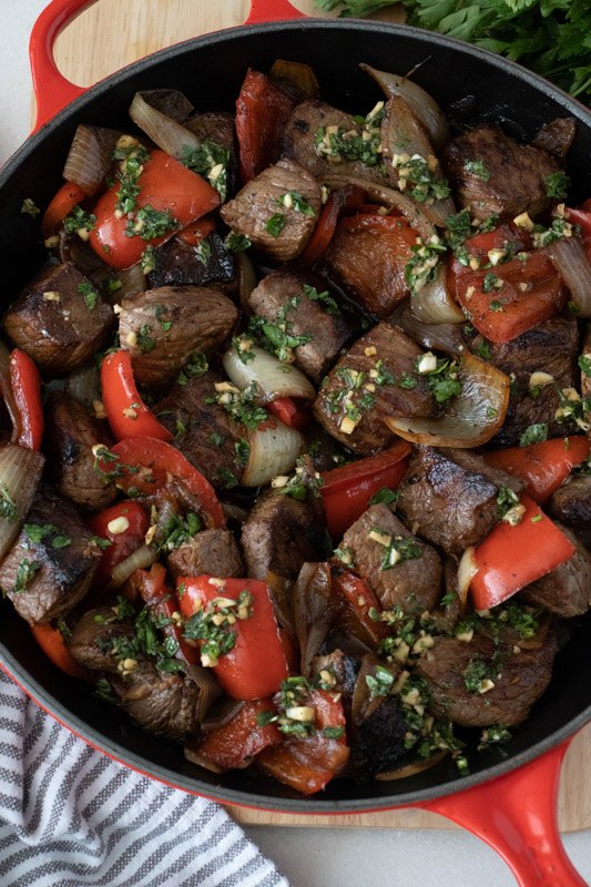 marinated sirloin steak tips with peppers and onions