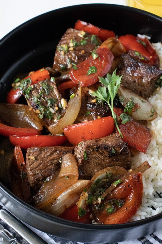 marinated sirloin steak tips with peppers and onions