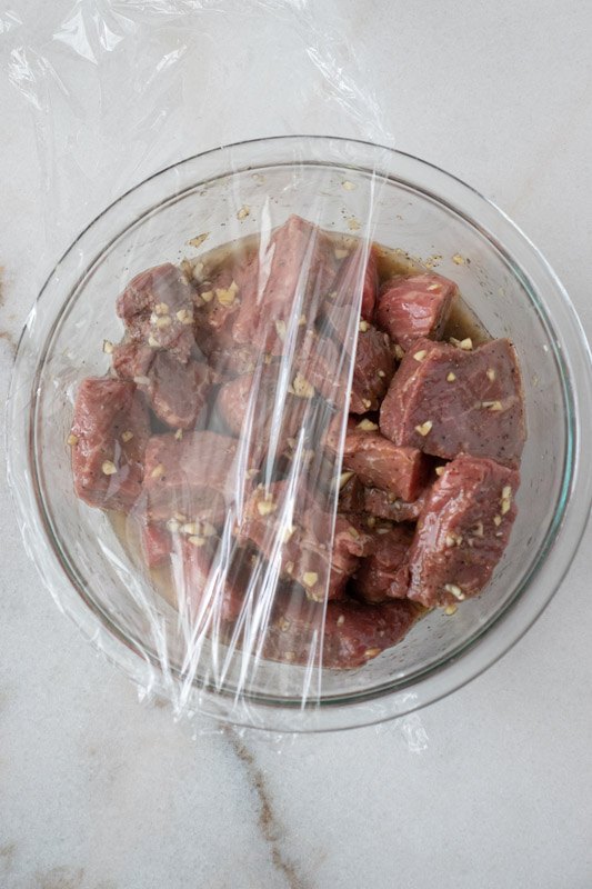 marinated sirloin steak tips with peppers and onions