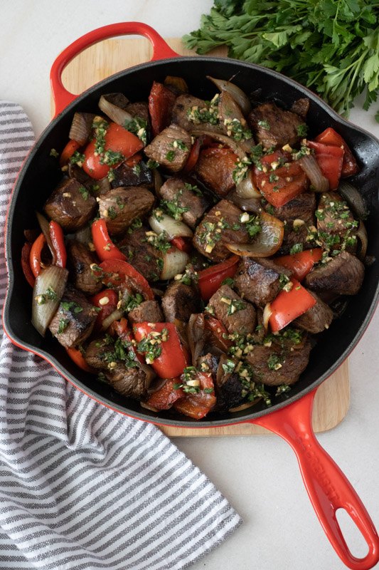 marinated sirloin steak tips with peppers and onions