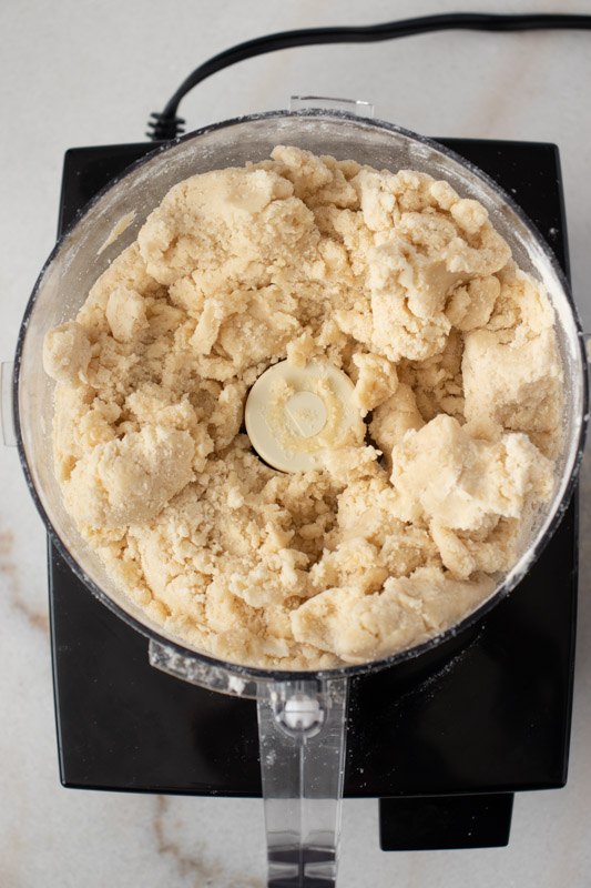 perfect pie crust, Add icy water and pulse until dough ball forms