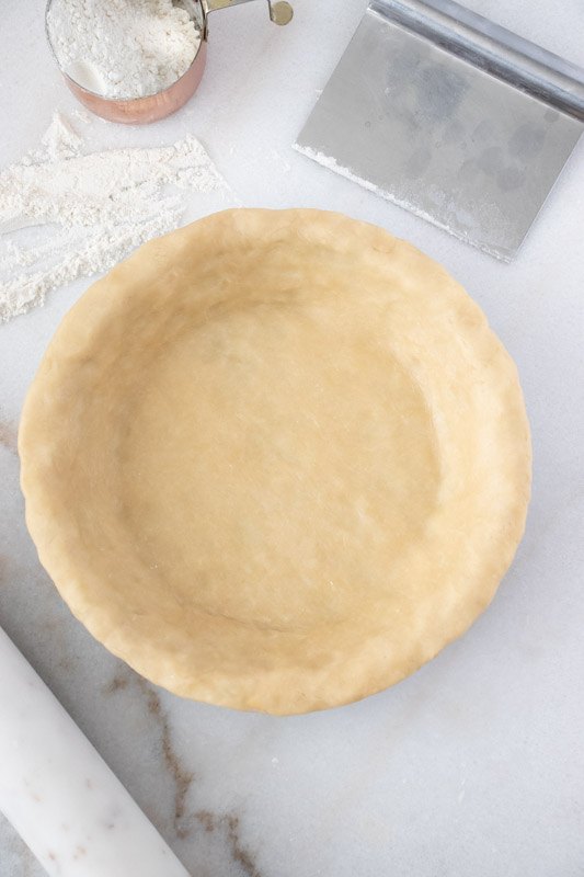 perfect pie crust, Press the dough into the pie dish Tuck the edges under gently pressing and smoothing the edges Choose a decorative edge or simply press with a fork around the edges for a quick decoration
