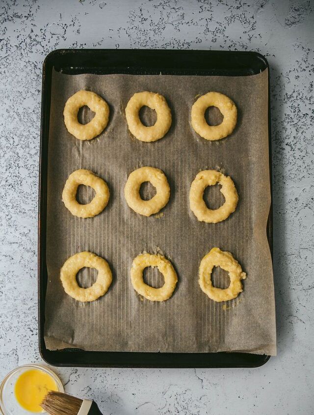 grain free donuts with raspberry filling and chocolate glaze, Grain free bagels being egg washed before baking