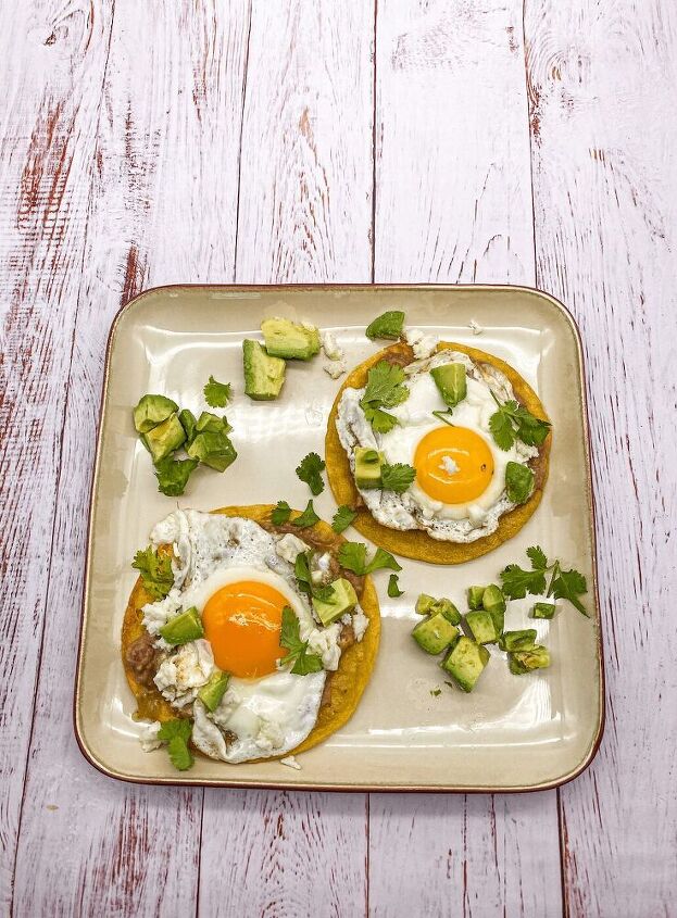 huevos rancheros fried tortilla topped with sunny side up egg