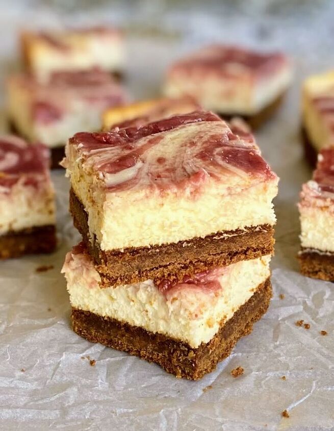 gingerbread cheesecake bars with a cranberry swirl