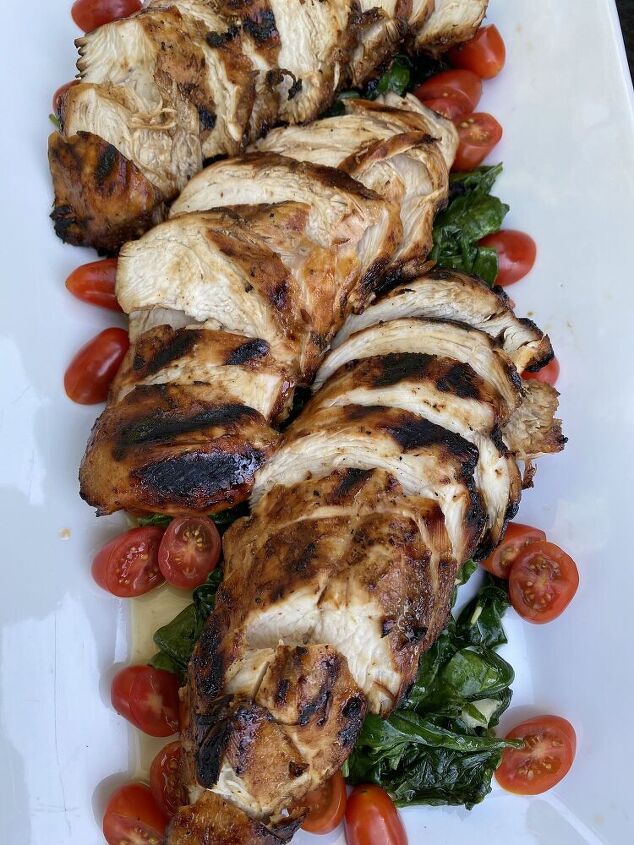 grilled chicken over wilted garlicky spinach