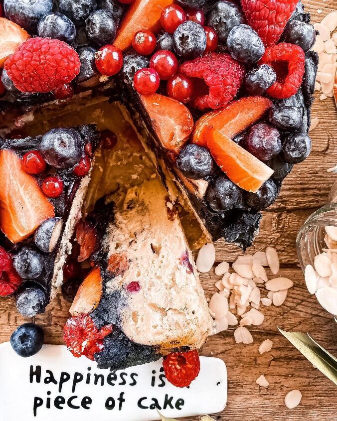 healthy almond cookie dough cake with chocolate frosting and berries