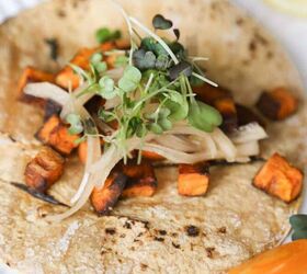 sweet potato tacos with black beans and pickled green onions
