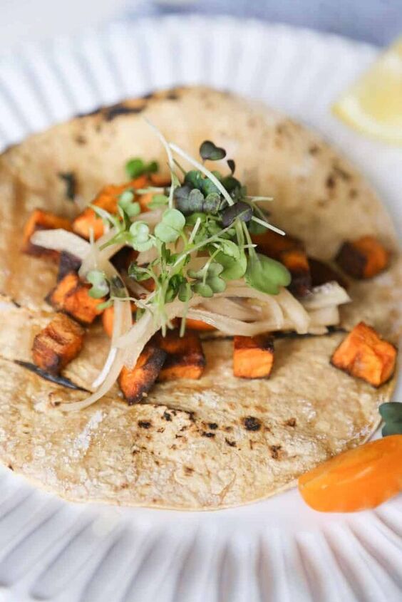 sweet potato tacos with black beans and pickled green onions