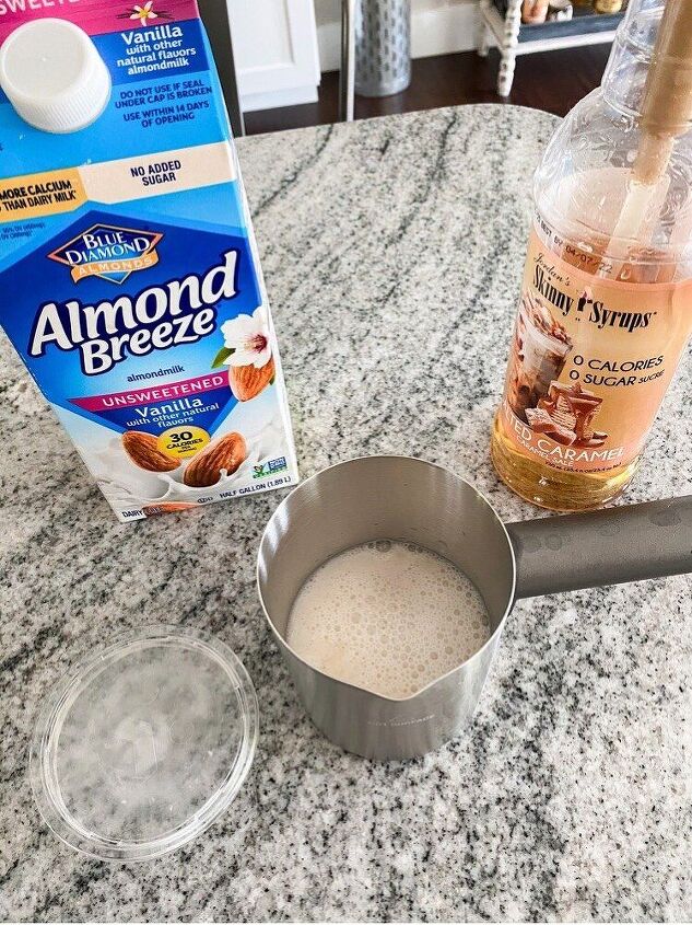 the easiest iced coffee recipe ever, Then I just pour the almond milk in to the max line