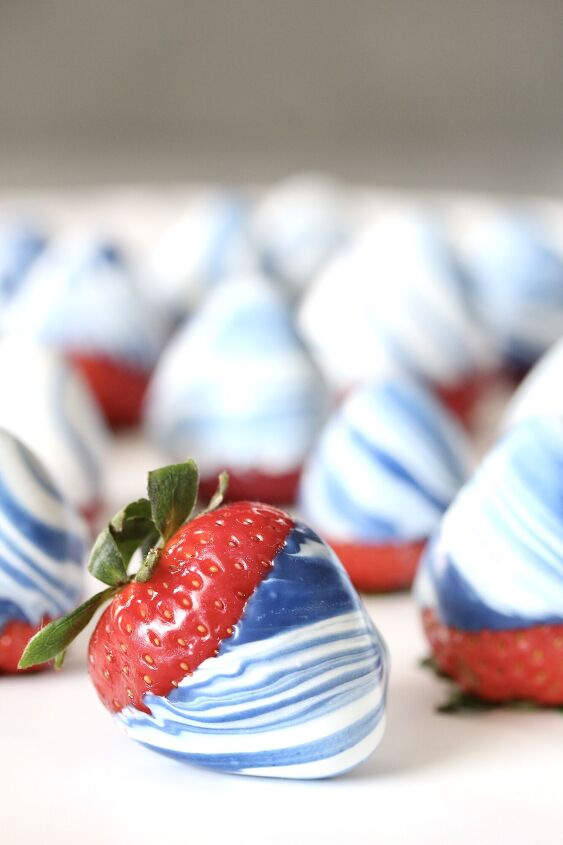 s 12 delicious red white and blue desserts for your july 4th bbq party, 4th of July Candy Swirled Strawberries