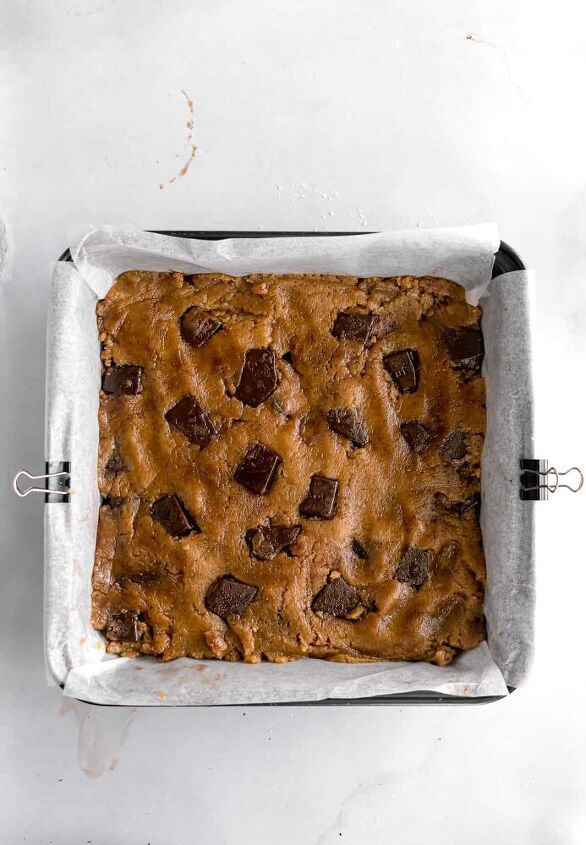 one bowl dark chocolate tahini blondies, Transfer to a lined 8 8 pan and press a few chocolate pieces on top