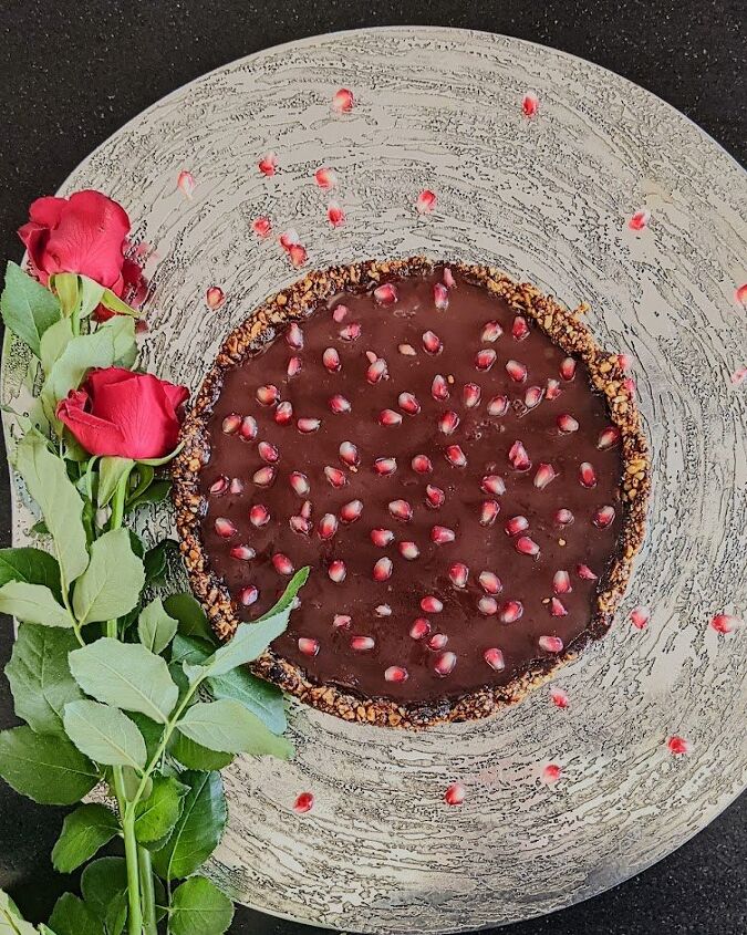 chocolate pomegranate tart with date and nut base