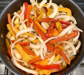 simple sausage skillet with onions peppers and potatoes happy hone, The onions peppers and potatoes cooking together in the skillet