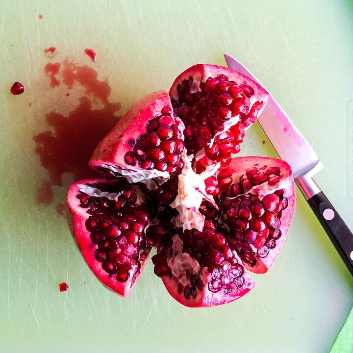 , Gently pull the fruit apart to expose the arils
