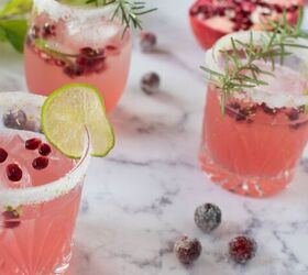 pomegranate ginger spritzer with candied cranberries and lime