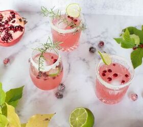 pomegranate ginger spritzer with candied cranberries and lime