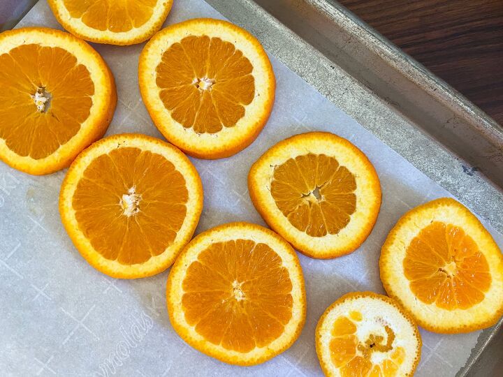 how to dry orange slices the kitchen garten, Sliced oranges on baking sheet