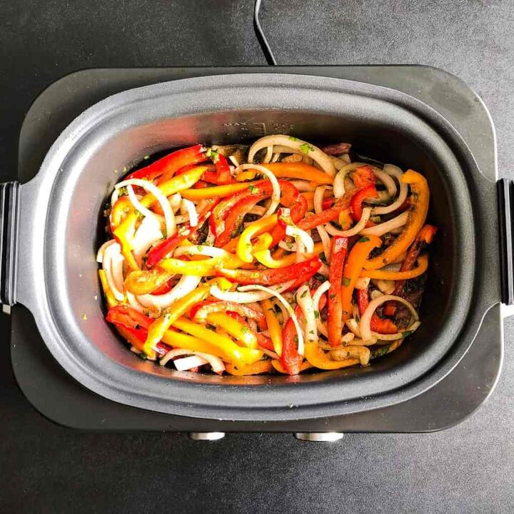 slow cooker carne asada, Place the flank steak peppers and onion in the slow cooker