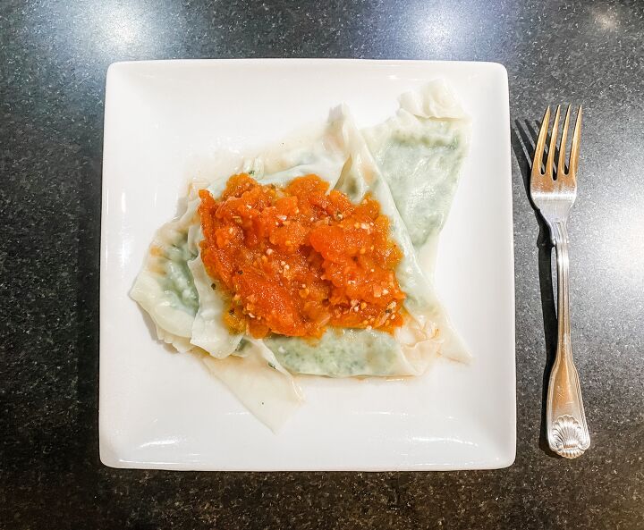 light homemade spinach and cheese ravioli with tomato sauce