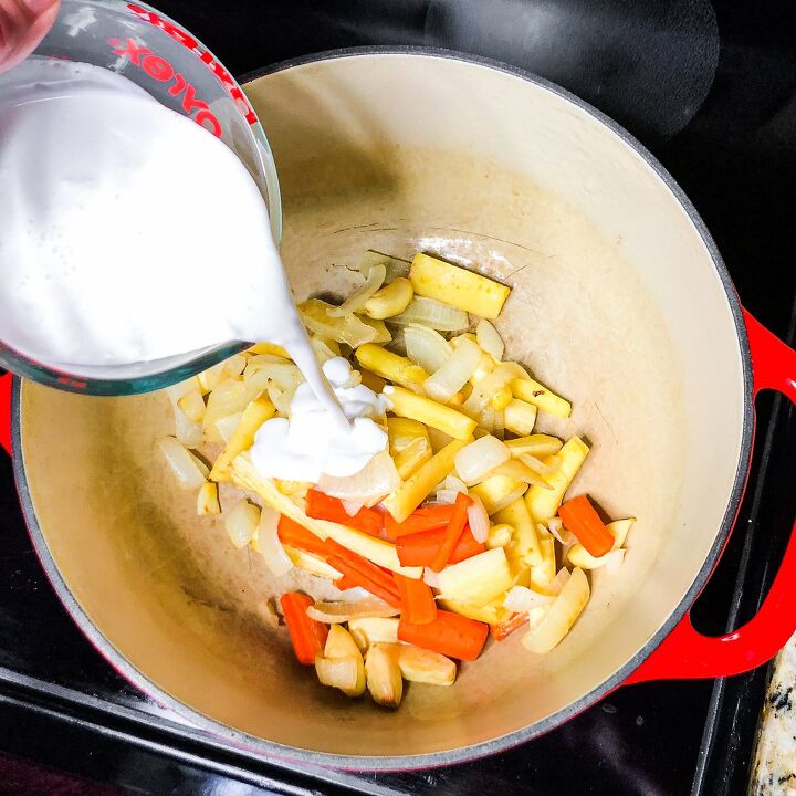 roasted butternut squash soup, Add roasted vegetables and coconut milk to Dutch oven
