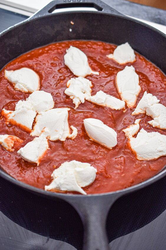 cheesy italian meatball sub dip, Add tomato sauce and ricotta to a cast iron skillet