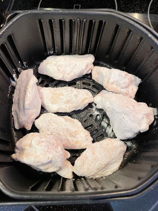 air fryer frozen chicken wings, Place the chicken wings in a greased air fryer basket