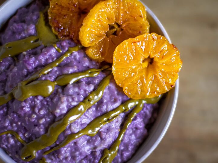 millet porridge, Millet porridge with blueberry powder caramelized clementines topped with pistachio butter