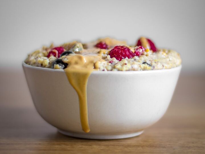 millet porridge, Millet Porridge with fresh raspberries and blueberries topped with almond butter