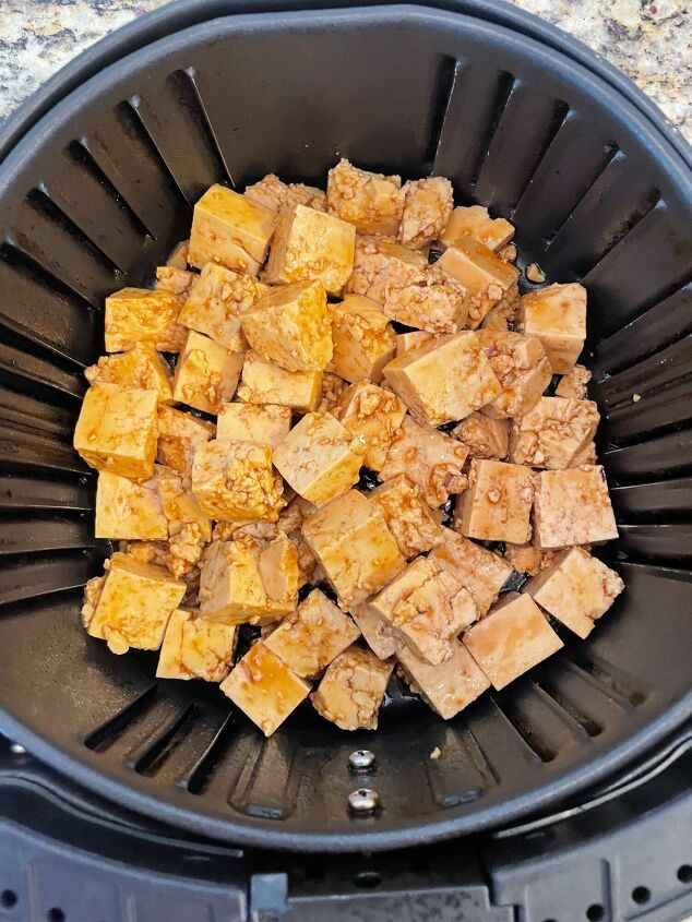 air fryer teriyaki tofu with stir fried vegetables and rice noodles, Tofu in the air fryer basket before cooking