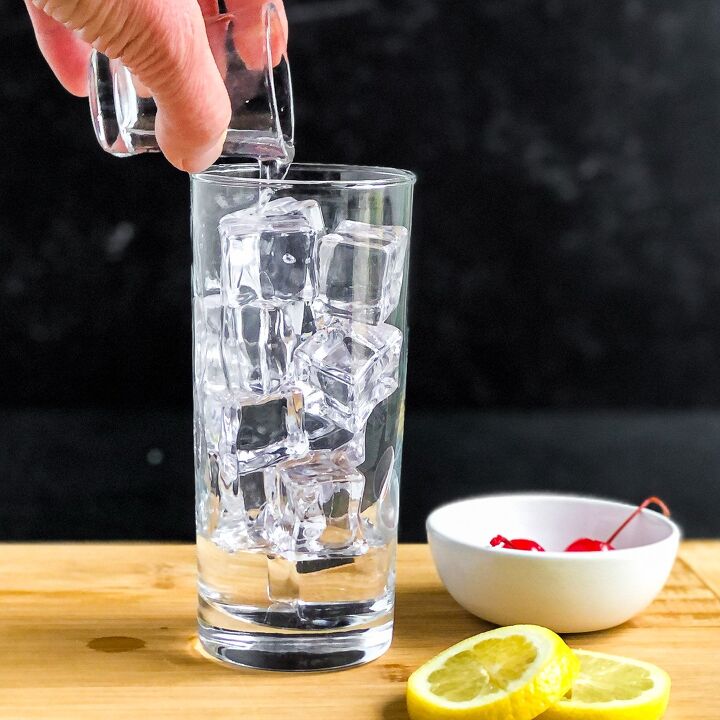 Add vodka to a highball glass filled with ice
