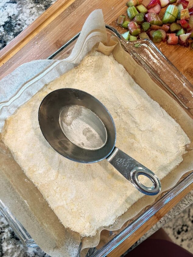 strawberry rhubarb bars, The bottom of a measuring cup works well to press the crust down evenly and firmly