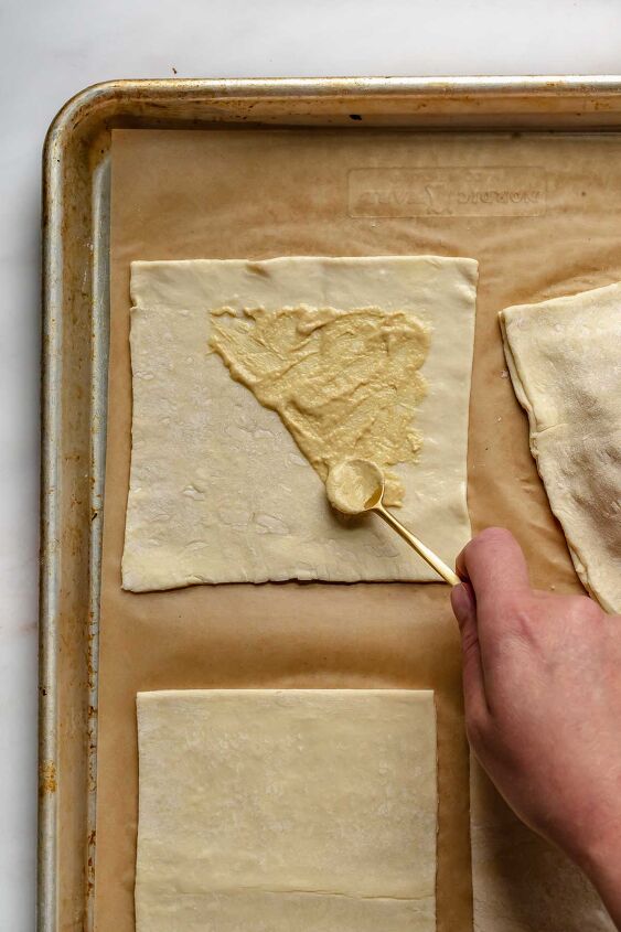 puff pastry ham and cheese turnovers, Add dijon mustard to half of the pastry square