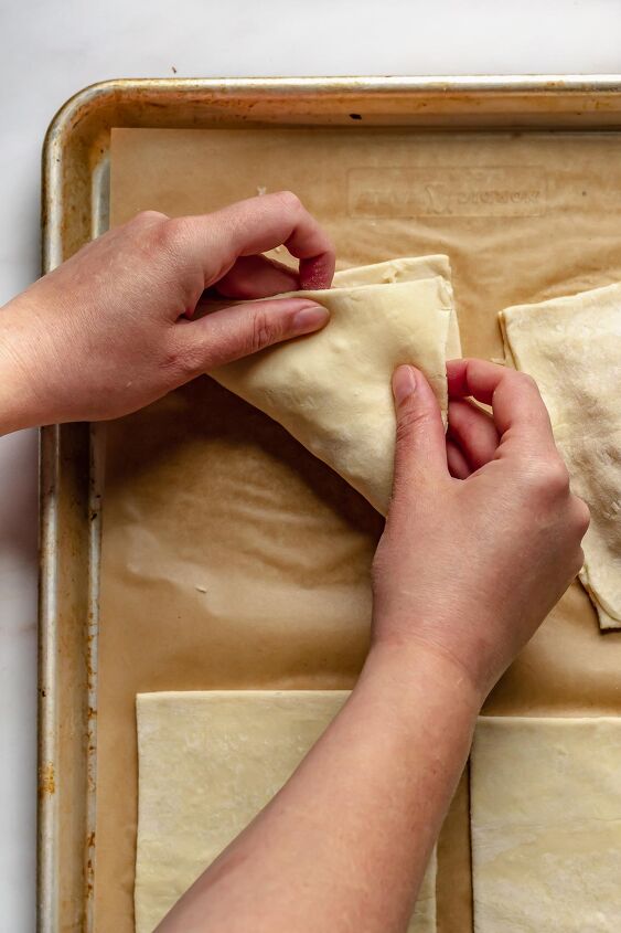 puff pastry ham and cheese turnovers, Wet exposed edges then gently pull the pastry and stretch it over top of the filling