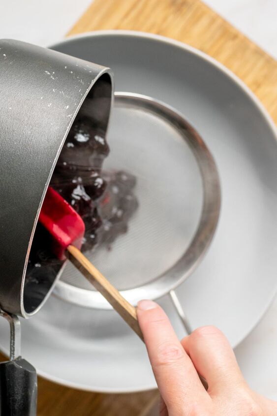 easy blueberry glaze for desserts, Pass the blueberries through a fine mesh sieve to separate the puree from the skins