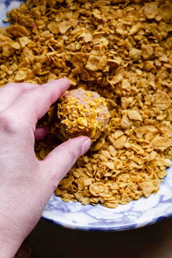 corn flake cereal cookies with freeze dried strawberries, Roll the dough through crushed cornflakes