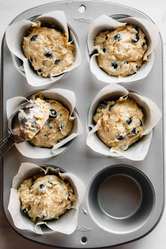 easy jumbo blueberry muffins bakery style, Scoop the batter into the muffin wells