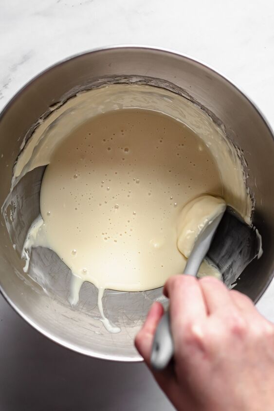 chocolate covered coconut cream eggs, Mix the butter and sweetened condensed milk then scrape the sides