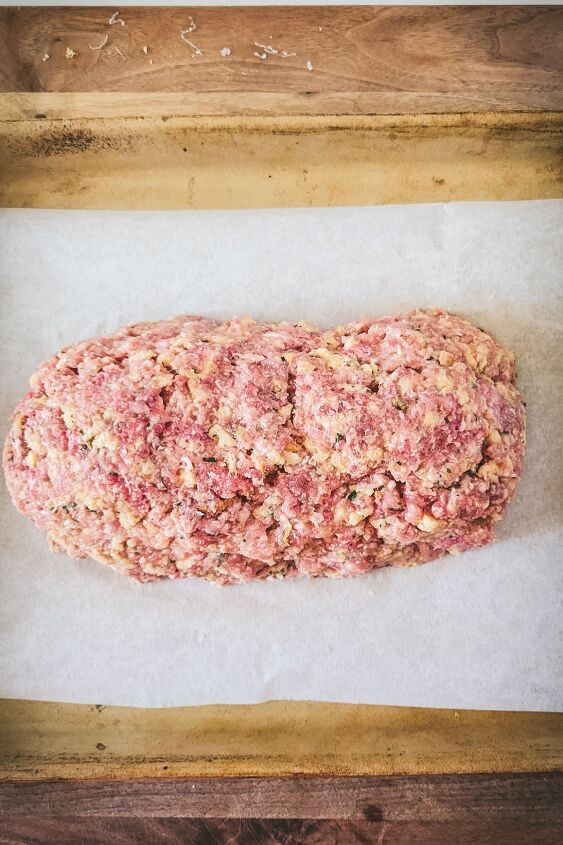 easy stovetop stuffing meatloaf with garlic butter sauce, Shape the mixture into a loaf on a parchment paper lined baking sheet