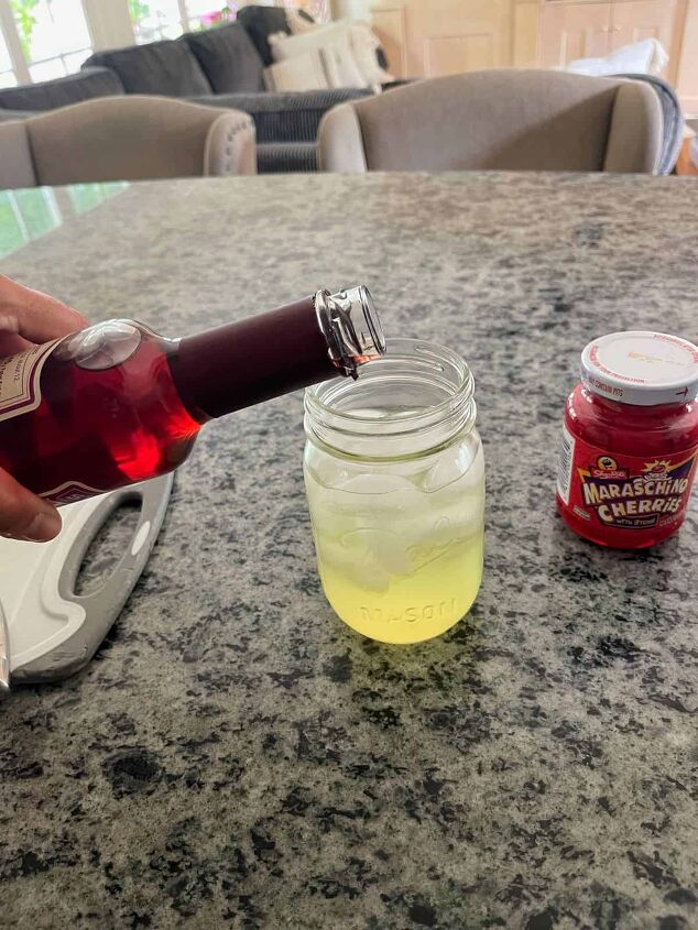 best mixed drink with rum for summer, Slowly pouring grenadine to create a color gradient for a Malibu sunset cocktail