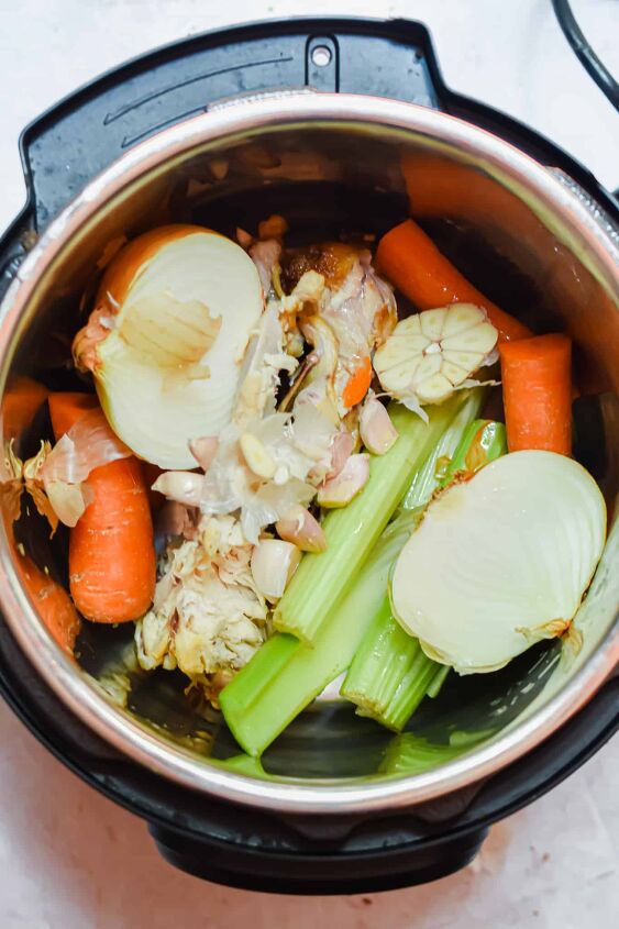 simple instant pot chicken broth, Add all the ingredients to the Instant Pot