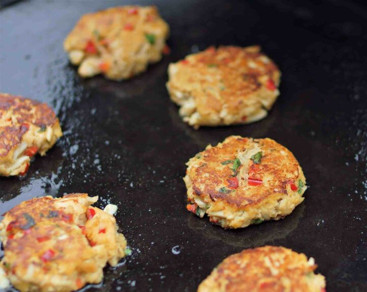 fried lump crab cakes with sriracha mayonnaise, Lump Crab Cakes cooking on a flat top