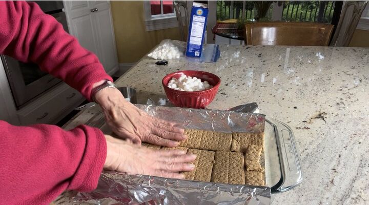 delicious s mores bars for your end of summer bash, Here I am arranging the graham crackers in a single layer over the foil lined 13 x 9 inch pan
